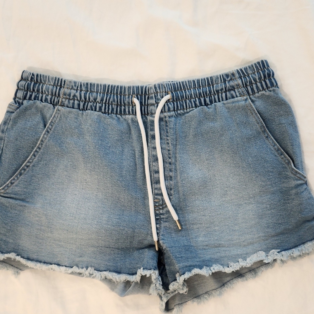 Celebrity Pink Blue Jean Shorts with Distressed and Raw Hem Details